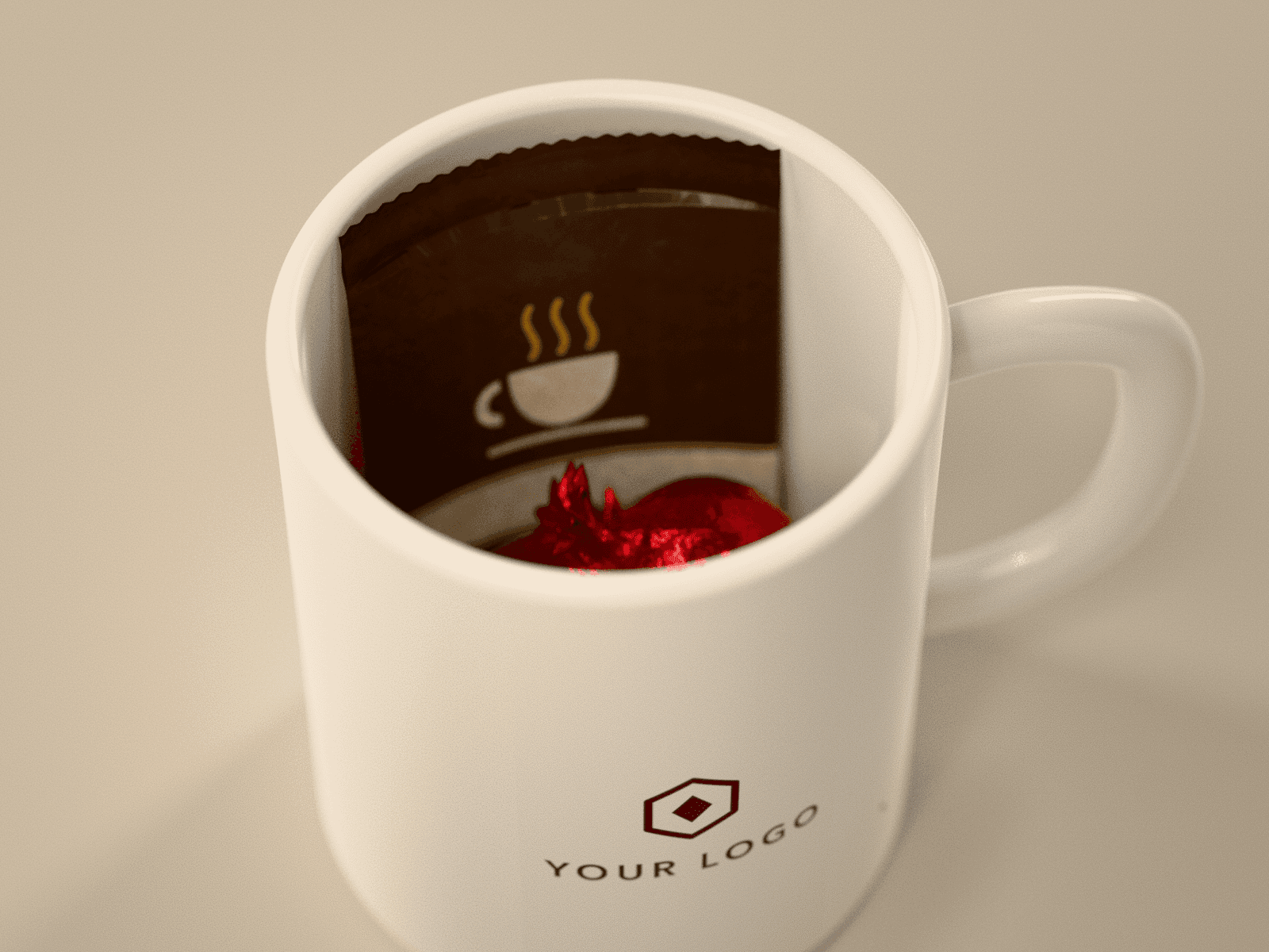 Hot cocoa and foil-wrapped truffles packed inside the logo mug